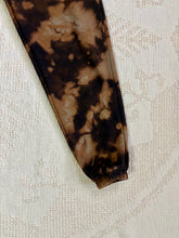 Load image into Gallery viewer, Vintage bleach-dyed sweatpants with a black and brown marbled pattern, elastic waistband, drawstring, and cuffed ankles