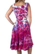 Load image into Gallery viewer, Back view of a 1950s hand dyed floral print fit and flare dress. 
