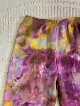 Load image into Gallery viewer, vintage ice-dyed sweatpants featuring a blend of deep magenta, golden yellow, and hints of white, creating a marbled effect. The ice dye technique produces organic, abstract patterns with soft color transitions. The pants have an elastic waistband and a slim fit.
