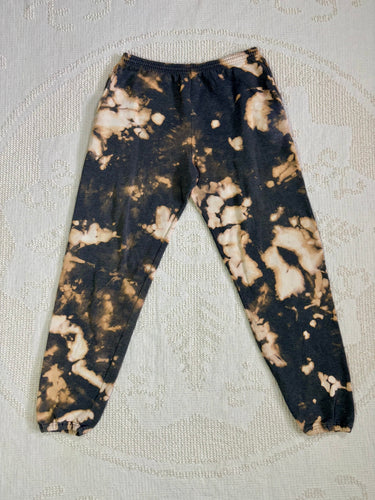 Reverse tie-dyed vintage sweatpants with drawstring waist and pockets, expertly hand-dyed for a unique, upcycled look. Good condition with no flaws