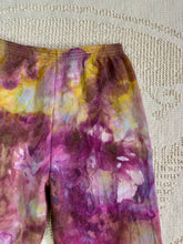 Load image into Gallery viewer, vintage ice-dyed sweatpants featuring a blend of deep magenta, golden yellow, and hints of white, creating a marbled effect. The ice dye technique produces organic, abstract patterns with soft color transitions. The pants have an elastic waistband and a slim fit.
