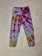 Load image into Gallery viewer, Vintage ice-dyed sweatpants featuring a mix of vibrant magenta, orange, and yellow hues against a light gray base. The pattern radiates outward, creating a bold and unique design. The pants have an elastic waistband and cuffs.
