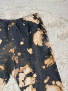 Reverse tie-dyed vintage sweatpants with drawstring waist and pockets, expertly hand-dyed for a unique, upcycled look. Good condition with no flaws